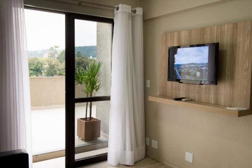 Μια τηλεόραση ή/και κέντρο ψυχαγωγίας στο Aquarius Hotel Flat Residence