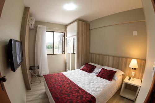 Ένα ή περισσότερα κρεβάτια σε δωμάτιο στο Aquarius Hotel Flat Residence