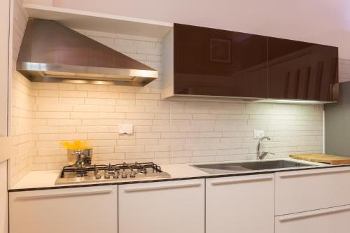 Η κουζίνα ή μικρή κουζίνα στο Giglio Apartments by Mmega