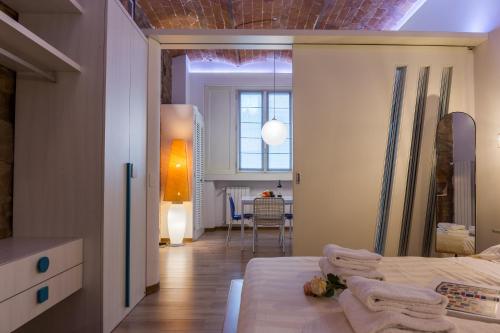 Ένα ή περισσότερα κρεβάτια σε δωμάτιο στο Giglio Apartments by Mmega