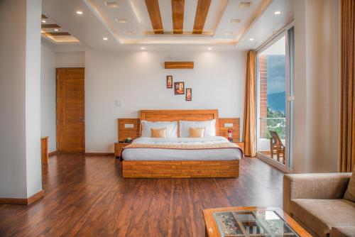 a bedroom with a bed and a couch at The White Haven Homestay (Shimla) in Shimla