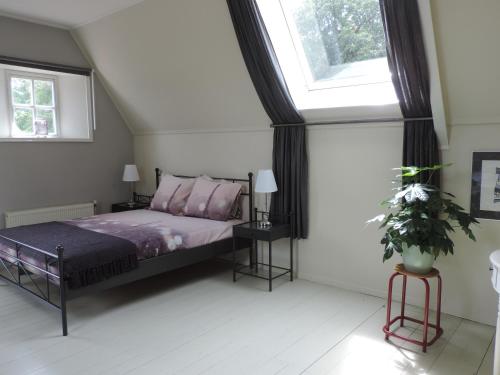 Postel nebo postele na pokoji v ubytování het Binnenhuis