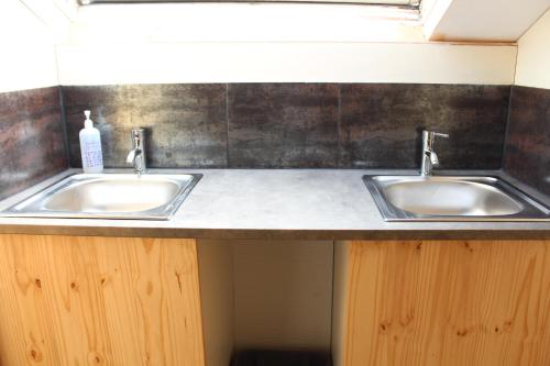 two sinks on a counter in a bathroom at Moulin2Roues in Artannes-sur-Thouet