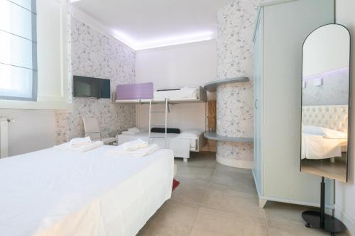 Ένα ή περισσότερα κρεβάτια σε δωμάτιο στο Giglio Apartments by Mmega