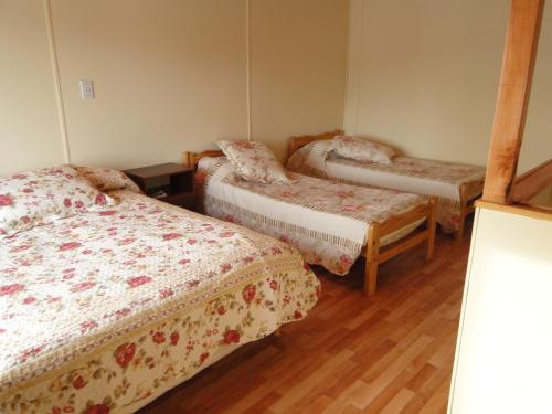 
Una cama o camas en una habitación de Cabañas Dolly Tolhuin
