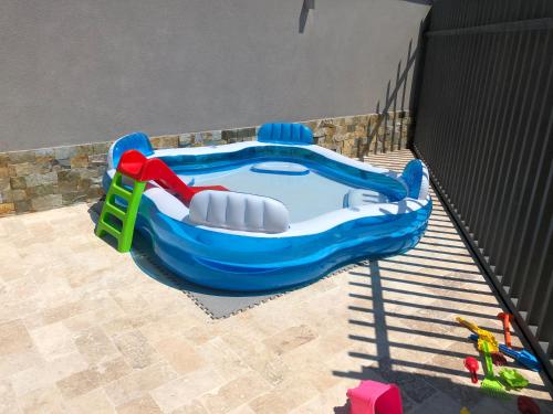 a plastic inflatable pool with a red handle and avisorangering at MAV Boutique Villa in Eforie Nord