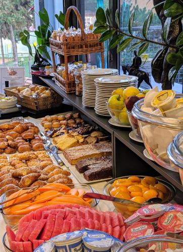 a buffet filled with lots of different types of food at Hotel Martini in Verona