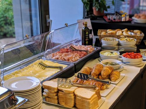a buffet with a lot of food on a table at Hotel Martini in Verona