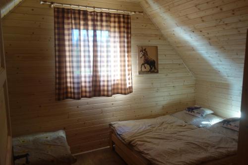 Tempat tidur dalam kamar di PANORAMA RANČ