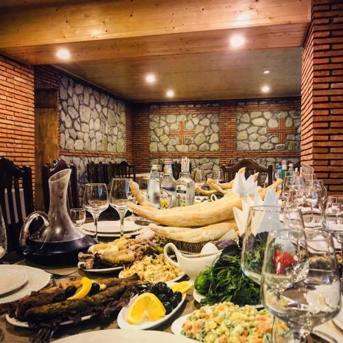 a long table with food on it in a restaurant at Royal Palace Hotel, Lagodekhi in Lagodekhi