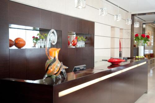 a kitchen with a counter with vases on it at The Levante Parliament A Design Hotel in Vienna