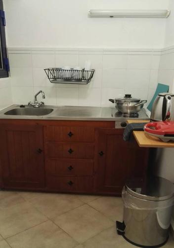 a kitchen with a sink and a counter top at Creta Star Apartments in Agia Galini