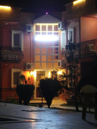 a building with a lit up door at night at Samdan Hotel in Pamukkale