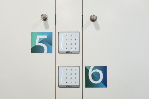 a row of clocks with numbers on them at Ilha Hostel & Suites in Ponta Delgada