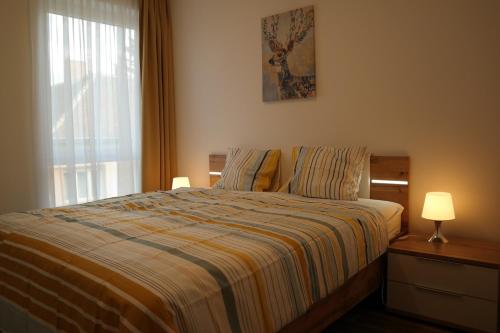 Krevet ili kreveti u jedinici u okviru objekta Holiday Apartman with Free Parking