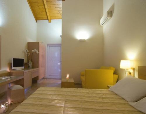 Ένα ή περισσότερα κρεβάτια σε δωμάτιο στο Verde Al Mare Boutique Hotel