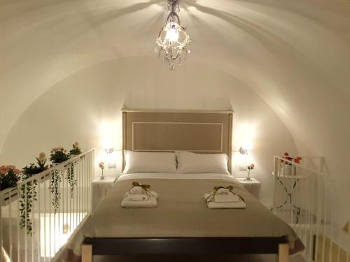 Posteľ alebo postele v izbe v ubytovaní SASSO BIANCO