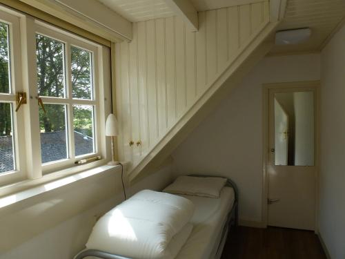 Säng eller sängar i ett rum på Vakantiewoning Salland