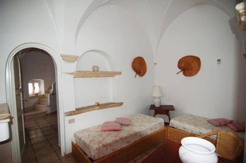 Postel nebo postele na pokoji v ubytování Villaggio In Case Sparse Nel Centro Storico