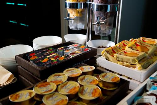 a table with two trays of food on top at Hotel Nazionale in Matera