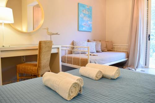a room with two beds and a desk and a mirror at AVIA HOLIDAY HOME 2 in Avia