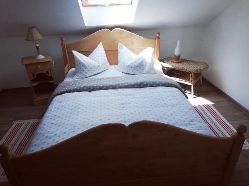 a bedroom with a large bed with white sheets and pillows at Dridif 135 in Dridif