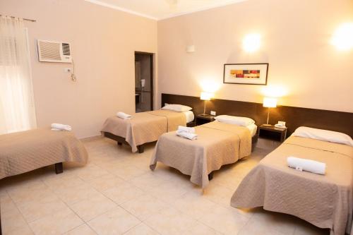Postel nebo postele na pokoji v ubytování Hotel Solano