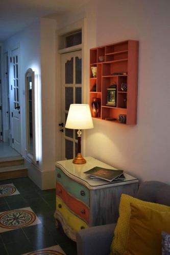 a room with a table with a lamp on it at Private Apartment in Pembroke St Julians in Pembroke 