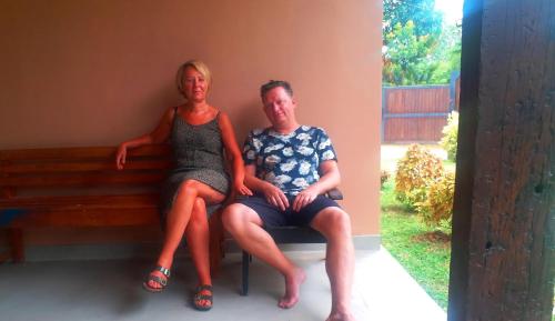 a man and a woman sitting on a bench at Honey Tree Polonnaruwa in Polonnaruwa