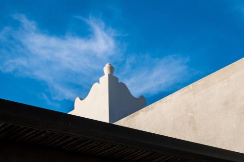 a white object on the side of a building at Hotel Residence Mendolita in Lipari