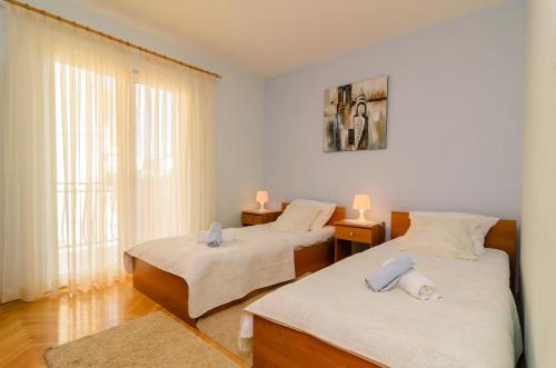 Ein Bett oder Betten in einem Zimmer der Unterkunft Apartments Amico