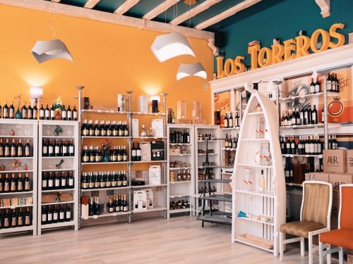 a wine store with shelves of wine bottles at Hotel Los Toreros in Tordesillas