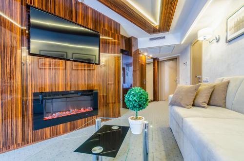 a living room with a couch and a fireplace at Tourist Hotel Complex in Kyiv