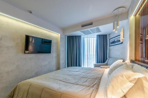 a hotel room with a bed and a television at Tourist Hotel Complex in Kyiv