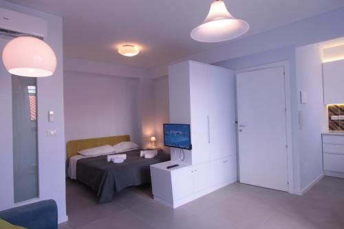 Ένα ή περισσότερα κρεβάτια σε δωμάτιο στο The Sea Rooms
