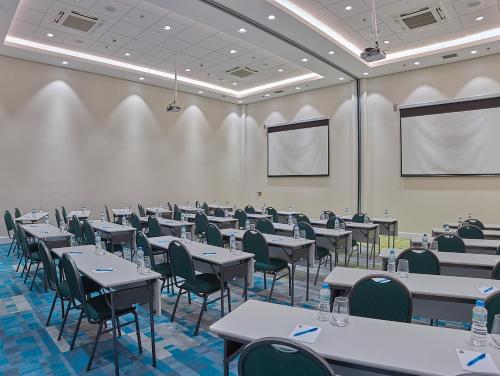 a conference room with tables and chairs in it at Rio Hotel by Bourbon Campinas in Campinas