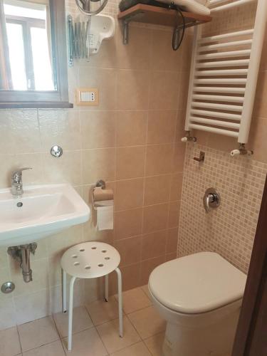 a bathroom with a toilet and a sink at B&B Le Stagioni in Potenza