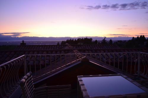 a view from the roof of a house at sunset at Altezza in La Morra
