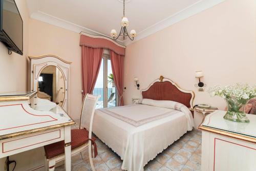 מיטה או מיטות בחדר ב-Hotel Il Nido