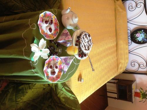 a table topped with donuts on a table at Magnolia House in Taurianova