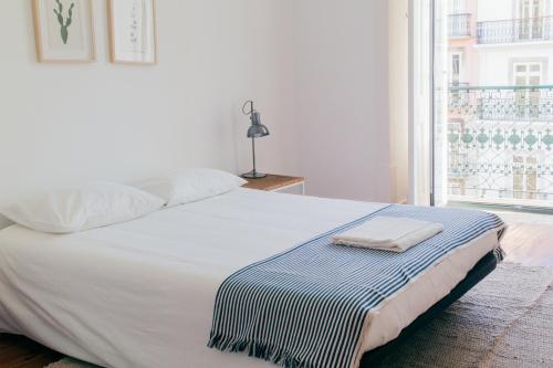 Outsite Coliving Lisbon - Cais do Sodreにあるベッド