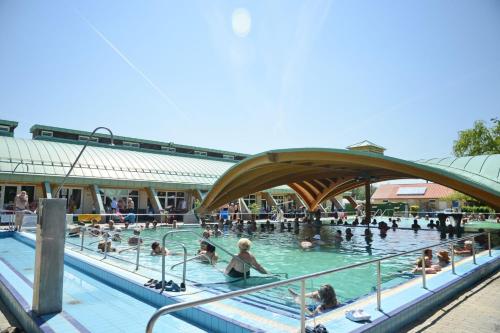 a group of people swimming in a swimming pool at Marvel-Nyaraló in Igal