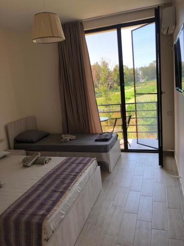 Postel nebo postele na pokoji v ubytování Lovely Villa Ureki