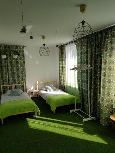 Кровать или кровати в номере Sielskie Apartamenty