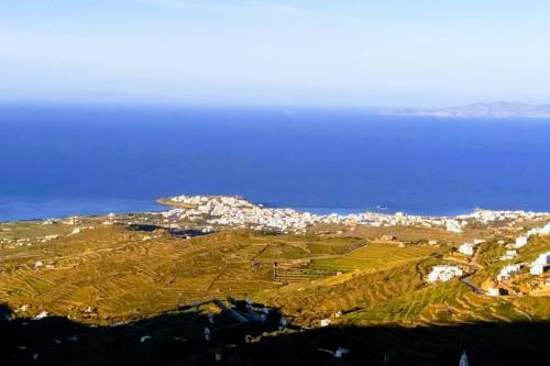 an aerial view of a town on a hill next to the ocean at Aegean Breeze in DYO CHORIA TINOS in Triandáros