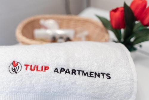 Säng eller sängar i ett rum på Tulip-Apartments - Jagiellońska 24 poddasze bez windy