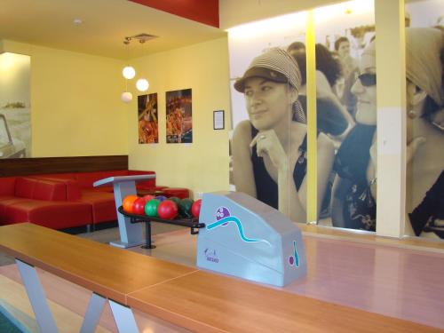 a ping pong table with a ping pong ball on it at Hotel Spolcentrum in Svit