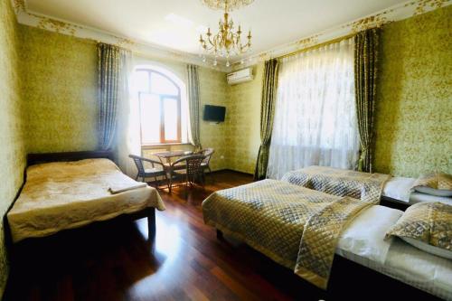 Ένα ή περισσότερα κρεβάτια σε δωμάτιο στο Mavie Guest House