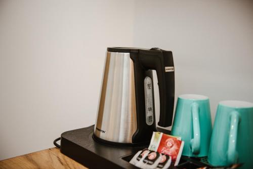 a coffee maker sitting on top of a table at VILLA 17 Noclegi in Płock