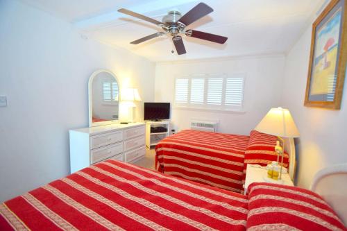a bedroom with two beds and a ceiling fan at Breakaway East 109 in Ocean City